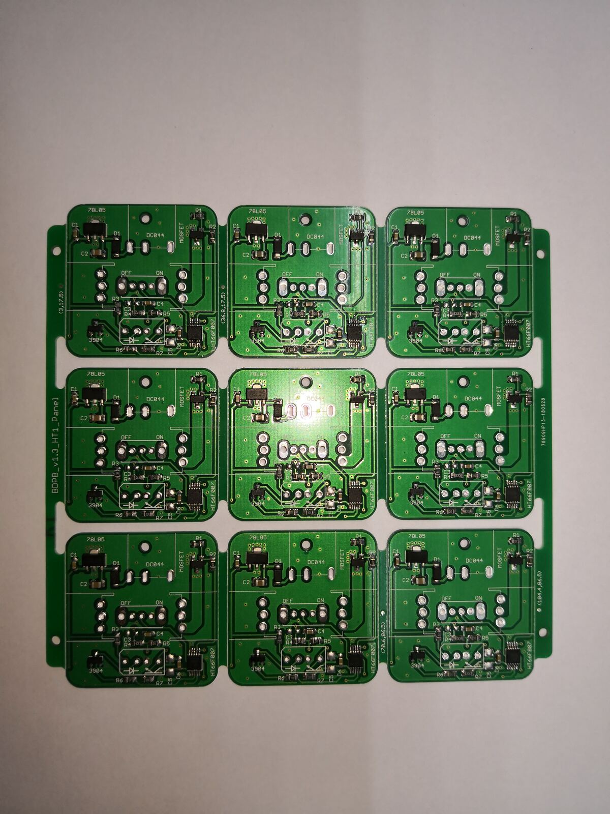 A panel of nine green circuit boards in a three-by-three grid on a white background.